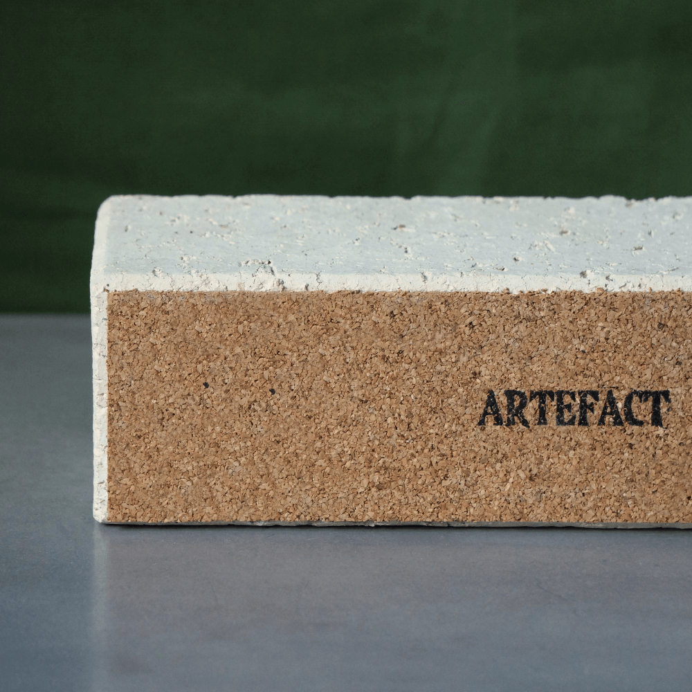 Underneath view of the centrepiece candleholder. The bottom is lined with a thin cork layer which reads 'Artefact'